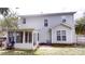 Back exterior of home with sunroom and fenced-in yard at 15280 Leslie Brook Rd, Huntersville, NC 28078