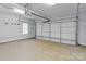 Spacious two-car garage with ample storage space and automatic door opener for easy access at 15280 Leslie Brook Rd, Huntersville, NC 28078