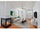 Inviting living room featuring a stylish fireplace, wood floors, and neutral decor at 15280 Leslie Brook Rd, Huntersville, NC 28078