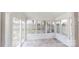 Bright sunroom with tile floors and lots of natural light at 15280 Leslie Brook Rd, Huntersville, NC 28078