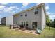 Spacious backyard featuring a patio, outdoor grill, basketball hoop, and a well-maintained lawn at 15636 Oleander Dr, Charlotte, NC 28278