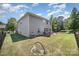 Backyard view of the property with a full fence, patio, and outdoor kitchen, and plenty of green grass at 15636 Oleander Dr, Charlotte, NC 28278