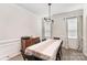 Bright dining room with a large table, modern lighting, and charming curtains at 15636 Oleander Dr, Charlotte, NC 28278
