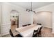 Open dining area with a glimpse into the kitchen, blending seamlessly with the living space at 15636 Oleander Dr, Charlotte, NC 28278