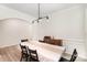 Elegant dining room with modern lighting, wainscoting, and a large table perfect for Gathering gatherings at 15636 Oleander Dr, Charlotte, NC 28278