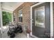 Inviting front porch featuring decorative accents and a cozy seating area near a decorative front door at 15636 Oleander Dr, Charlotte, NC 28278
