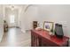 Stylish hallway featuring wood floors, archways, and decorative elements and an open concept design at 15636 Oleander Dr, Charlotte, NC 28278