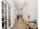 Bright hallway showcasing the home's open layout and elegant archway, leading to a spacious living area at 15636 Oleander Dr, Charlotte, NC 28278