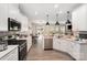 Bright kitchen featuring sleek countertops, white cabinets, and open layout at 15636 Oleander Dr, Charlotte, NC 28278
