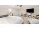 Spacious main bedroom featuring a ceiling fan and a large TV on a white stand at 15636 Oleander Dr, Charlotte, NC 28278