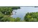 Expansive lake view with multiple docks and watercraft surrounded by lush greenery at 16112 Terry Ln, Huntersville, NC 28078