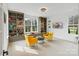 Bright bonus room with bookshelves, comfortable seating, and natural light at 16112 Terry Ln, Huntersville, NC 28078