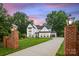 Stunning new construction home with a large front yard and modern design elements at 16112 Terry Ln, Huntersville, NC 28078