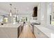 Contemporary kitchen design with marble countertops, custom cabinetry, and stainless steel appliances, ideal for entertaining at 16112 Terry Ln, Huntersville, NC 28078