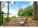 Beautiful lake view with inviting waterfront and lush greenery and a kayak at 16112 Terry Ln, Huntersville, NC 28078