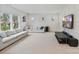 Bright living room featuring neutral tones, large windows, and comfortable seating at 16112 Terry Ln, Huntersville, NC 28078