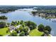 Breathtaking aerial view of a lakeside home with stunning water views and lush greenery at 174 Hickory Hill Rd, Mooresville, NC 28117