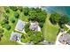 Stunning aerial view showcases a sprawling estate with lush landscaping and waterfront proximity at 174 Hickory Hill Rd, Mooresville, NC 28117
