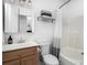 Clean bathroom features a wood vanity, open mirror, and bathtub with shower at 174 Hickory Hill Rd, Mooresville, NC 28117