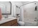 Bright bathroom features a white vanity, mirrored medicine cabinet, and bathtub with shower at 174 Hickory Hill Rd, Mooresville, NC 28117