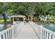 Long white dock extending into the water, offering a serene path to the waterfront gazebo at 174 Hickory Hill Rd, Mooresville, NC 28117