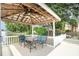 Comfortable seating area inside a covered dock with views of the water and surrounding landscape at 174 Hickory Hill Rd, Mooresville, NC 28117