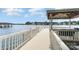 Inviting view from the dock with a covered area and seating, ideal for lakeside relaxation and entertaining at 174 Hickory Hill Rd, Mooresville, NC 28117