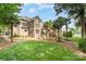 Beautifully landscaped backyard with mature trees, stone accents, and a serene outdoor space at 174 Hickory Hill Rd, Mooresville, NC 28117