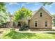 Charming brick home with a manicured lawn, lush landscaping, and inviting front entrance at 174 Hickory Hill Rd, Mooresville, NC 28117