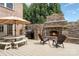 This patio features an outdoor fireplace, seating, and a built-in grill, perfect for entertaining at 174 Hickory Hill Rd, Mooresville, NC 28117