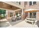 Covered patio area with plenty of space and a ceiling fan overlooking the backyard at 174 Hickory Hill Rd, Mooresville, NC 28117
