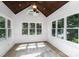 A sunroom with vaulted wood ceilings and large windows providing natural light and outdoor views at 174 Hickory Hill Rd, Mooresville, NC 28117