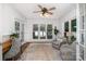 Bright sunroom with ample windows, comfortable seating, and views of the water at 174 Hickory Hill Rd, Mooresville, NC 28117