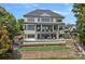A backyard featuring an infinity pool with lounge chairs and outdoor seating with beautiful water views at 18007 Harbor Light Blvd, Cornelius, NC 28031