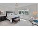 Comfortable bedroom featuring a large window providing ample natural light and a view of the outdoors at 18007 Harbor Light Blvd, Cornelius, NC 28031
