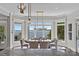 Lake view dining room with custom lighting and bay windows at 18007 Harbor Light Blvd, Cornelius, NC 28031