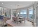 Bright dining area with bay windows, chandelier, and beautiful lake views at 18007 Harbor Light Blvd, Cornelius, NC 28031