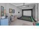 Basement golf simulator featuring projector, screen, and putting green at 18007 Harbor Light Blvd, Cornelius, NC 28031