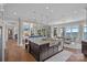 Open concept kitchen with an island, stainless steel sink, and views of the living room and lake at 18007 Harbor Light Blvd, Cornelius, NC 28031