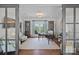Bright office with hardwood floors, built-in bookcases, and a balcony showcasing lovely outdoor views at 18007 Harbor Light Blvd, Cornelius, NC 28031