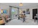 Charming office space with a glass desk and outside access, perfect for a peaceful workspace at 18007 Harbor Light Blvd, Cornelius, NC 28031
