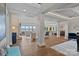 Open floor plan of a living room with water views and sight lines into the kitchen and breakfast nook at 18007 Harbor Light Blvd, Cornelius, NC 28031