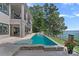 Backyard pool with lake views and spacious lounging area at 18007 Harbor Light Blvd, Cornelius, NC 28031