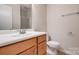 Bathroom featuring a vanity, toilet, towel bar, and walk-in shower at 1801 Teddington Dr, Charlotte, NC 28214