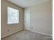 Cozy bedroom with neutral walls and carpet flooring at 1801 Teddington Dr, Charlotte, NC 28214