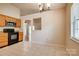 Cozy kitchen with wood cabinets and a view into the living area at 1801 Teddington Dr, Charlotte, NC 28214