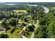 Panoramic aerial view of homes nestled among mature trees near a scenic lake at 1958 Cameron Heights Cir, Denver, NC 28037
