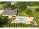 Aerial view of backyard with a pool, hot tub, patio and meticulously manicured lawn at 1958 Cameron Heights Cir, Denver, NC 28037