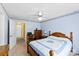 Bedroom with blue walls, ceiling fan, a window, and doorway at 1958 Cameron Heights Cir, Denver, NC 28037