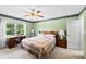 Comfortable bedroom with a ceiling fan, desk, and natural light at 1958 Cameron Heights Cir, Denver, NC 28037